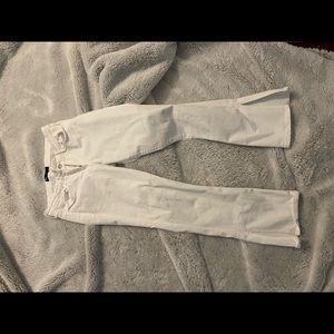 Super cute white long jeans with a slit at the bottom! Super trendy.